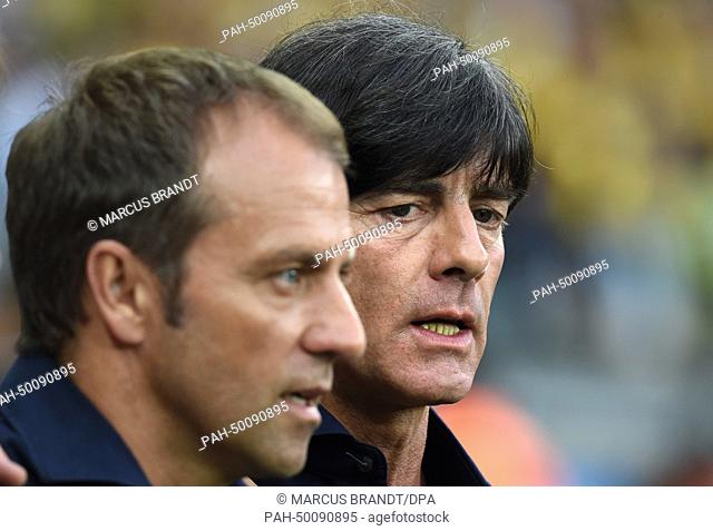 German head coach Joachim Loew (R) and German assistant coach Hansi Flick during the FIFA World Cup 2014 semi-final soccer match between Brazil and Germany at...