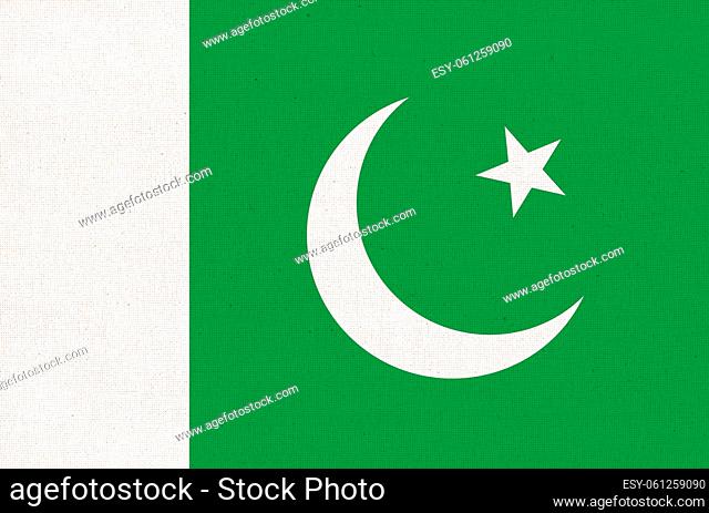 Flag of Islamic Republic of Pakistan. Pakistan flag on fabric surface. Fabric Texture. National symbol of Pakistan