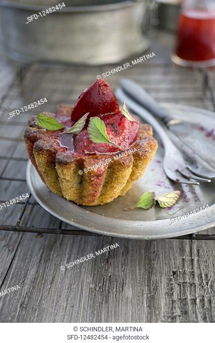 A cake with port wine plums and meadowsweet