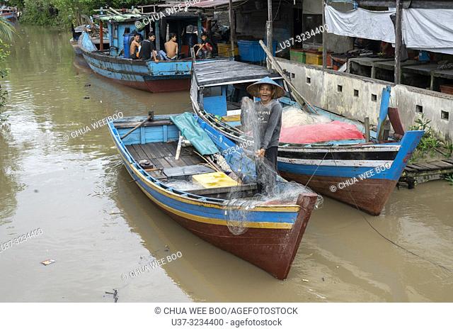 Small fishing boats at Sungai Bakau Kecil, West Kalimantan, Indonesia