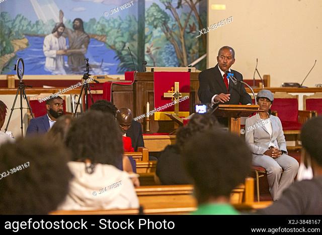 Detroit, Michigan - Candidates for the District 4 seat on Detroit City Council talk with voters during a candidates forum at Jordan Missionary Baptist Church