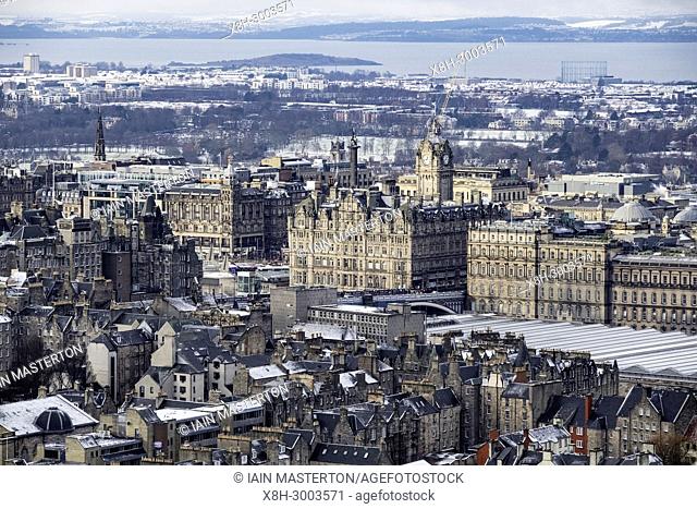View over city centre of Edinburgh during winter after a snowfall, Scotland, United Kingdom