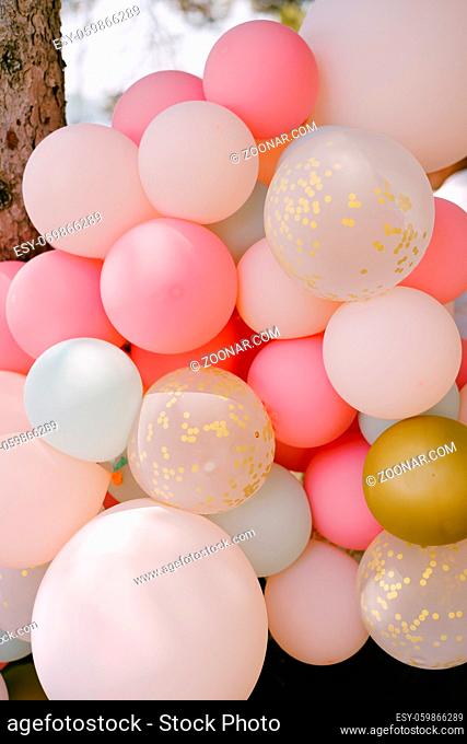 Close-up of many helium balloons in pastel colors. High quality photo