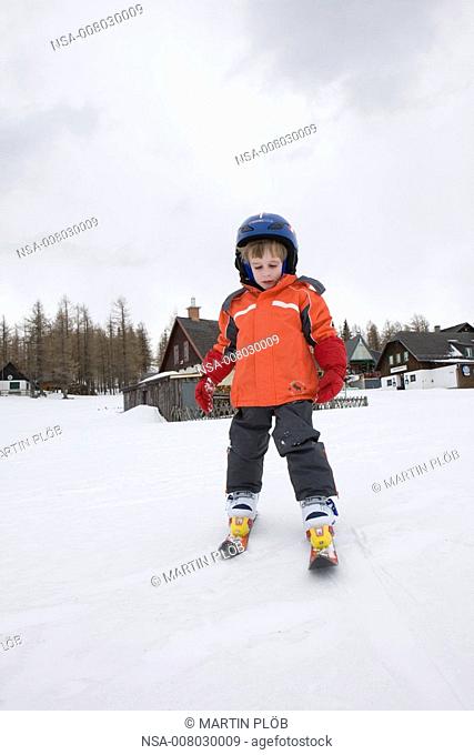 little boy learns to ski