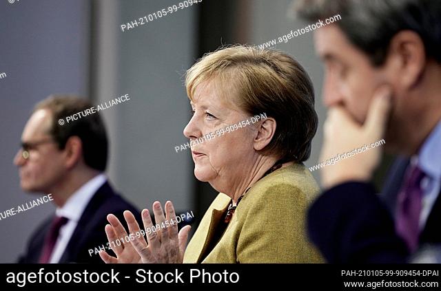 05 January 2021, Berlin: German Chancellor Angela Merkel (CDU), joins Markus Söder (CSU, r), Prime Minister of Bavaria and CSU Chairman