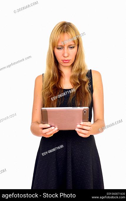 Studio shot of beautiful businesswoman with blond hair isolated against white background
