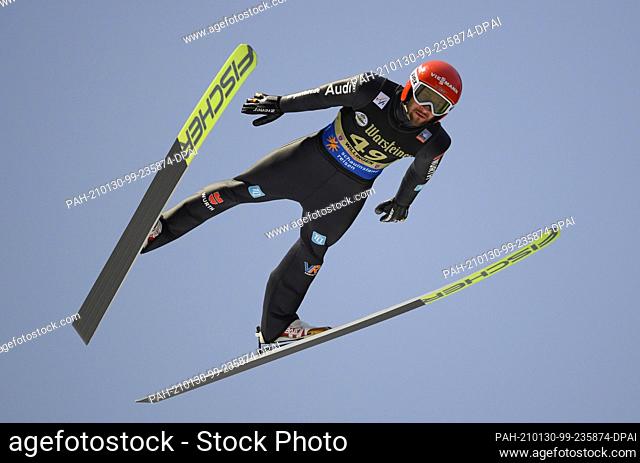 30 January 2021, Hessen, Willingen: Nordic skiing, ski jumping: World Cup, large hill, men. Markus Eisenbichler from Germany jumps in round 1 from...