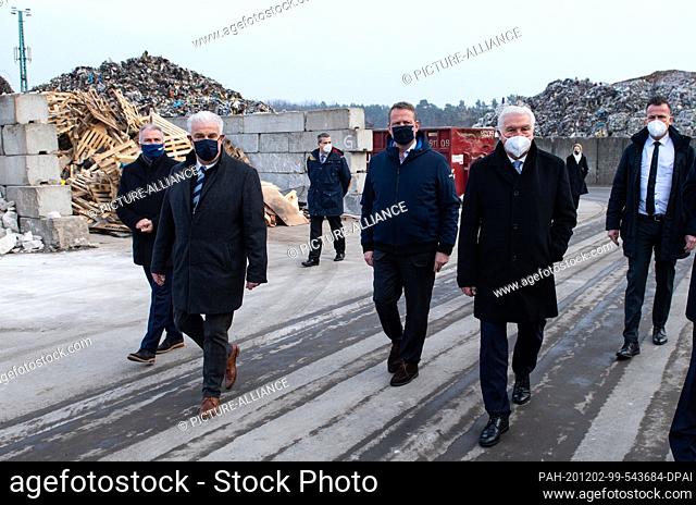 02 December 2020, Brandenburg, Oranienburg: During a visit to Grunske Metall-Recycling, Federal President Frank-Walter Steinmeier (r) is shown around the...