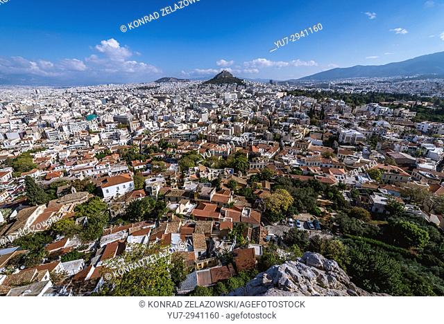 Aerial view from Acropolis of Athens city on Plaka historical district, Greece. Mount Lycabettus seen on photo