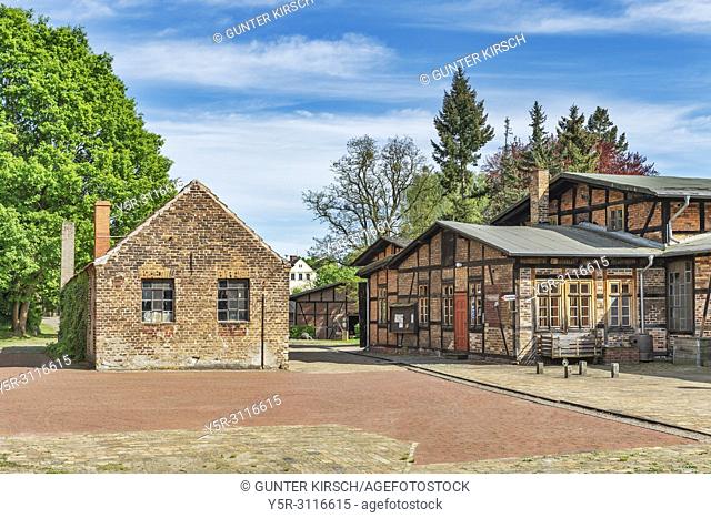 The Forge building (left) and the Glassblowing building (right) are located in the museum village Baruther Glashuette. Glashuette is located in the city Baruth...