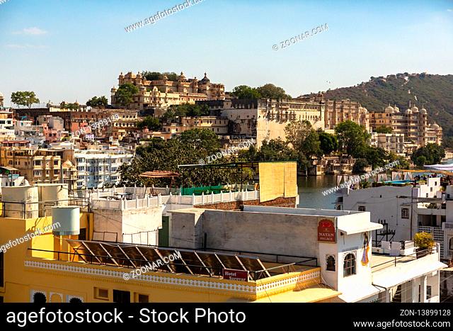 UDAIPUR, INDIA - NOVEMBER 24, 2012: Houses on the streets of Udaipur at sunset