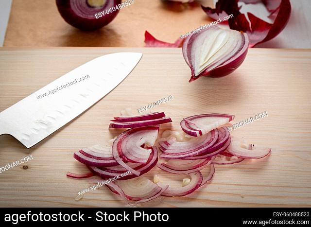 fresh healthy organic chopped onion on cuttingboard