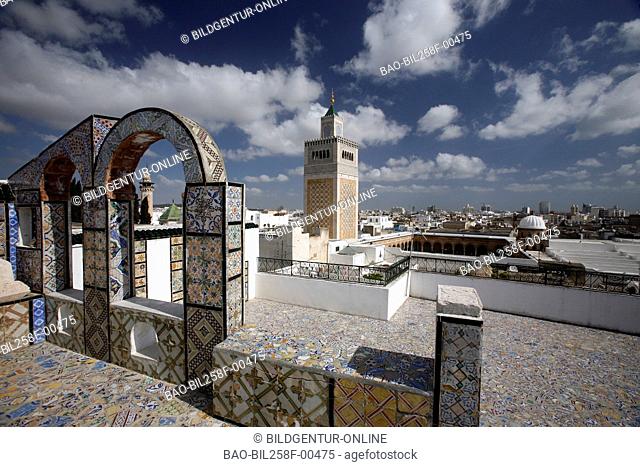 The minaret of the MoscheeZaytouna or big mosque in the Old Town or Medina of the capital of Tunis in the Norder of Tunisia in North Africa at the Mediterranean...