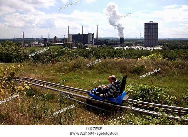 two person on a sommer chute of alpine centre on the area of coking plat Prosper, Germany, North Rhine-Westphalia, Ruhr Area, Bottrop