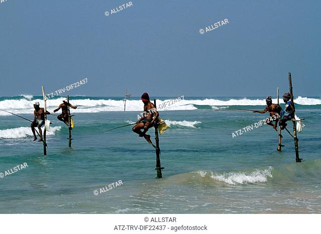 STILT FISHERMEN & INDIAN OCEAN; WELIGAMA, SRI LANKA, ASIA; 18/03/2013