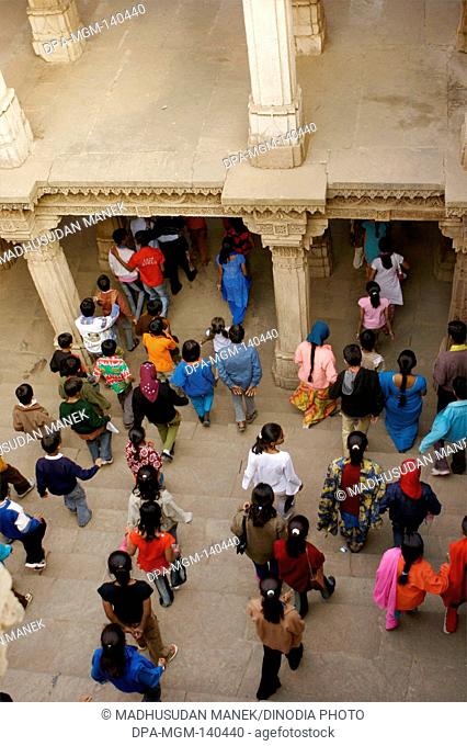 Visitors at Adalaj Vava step well built by Queen Rudabai Heritage site ; Ahmedabad ; Gujarat ; India