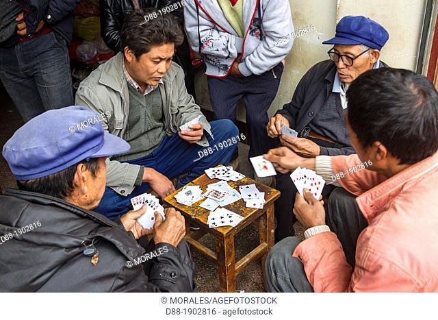 China, Yunnan Province, Kunming Municipality, Dongchuan District, Niujie village, local market, Hans people, playing cards