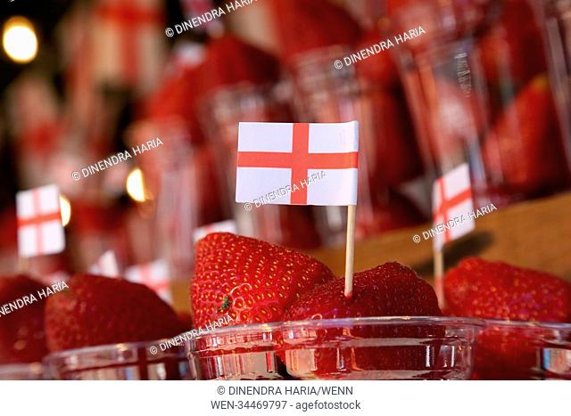 A fruit drink stall near Bond Street underground station decorated with St George's flag. England next plays Colombia in the knock out stages on Tuesday 3 July