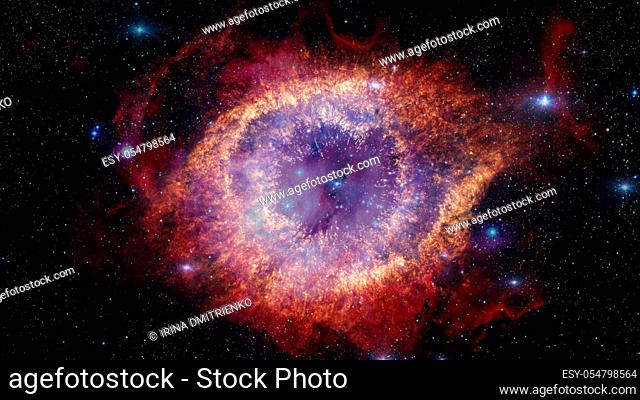 The Helix Nebula is a large planetary nebula located in the constellation Aquarius. Elements of this image furnished by NASA