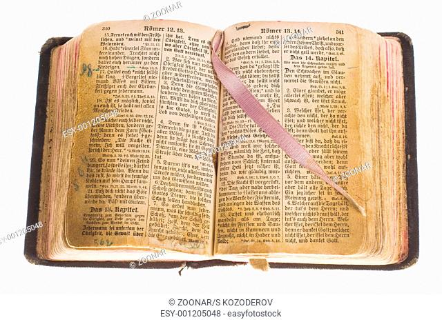 Old gothic antique vintage open bible with bookmark isolated on white background with cliping path