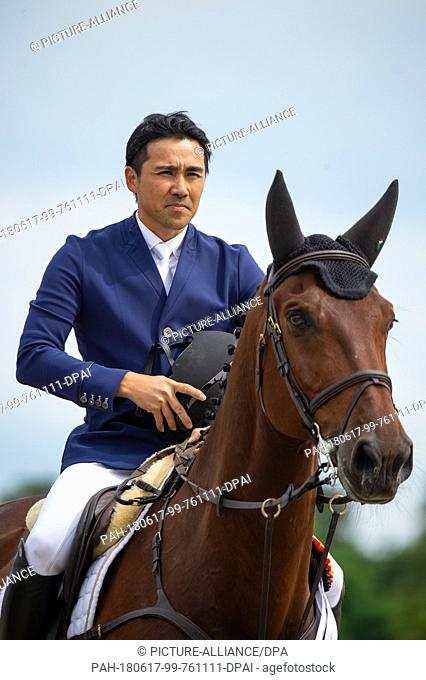 17 June 2018, Luhmuehlen, Germany: Yoshiaki Oiwa, eventer from Japan sits on his horse ""The Duke Of Cavan"" after taking third place during the German Eventing...