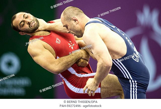 Georgias Elizbar Odikadze (red) competes with Khetag Gazyumov of Asherbaijan (blue) in the wrestling Men's 97kg Freestyle Final at the Baku 2015 European Games...