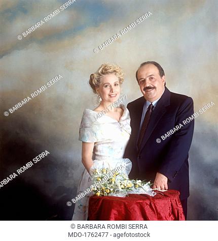 Portrait of Marta Flavi and Maurizio Costanzo smiling at their marriage. Portrait of Italian journalist and TV host Maurizio Costanzo smiling beside his wife...