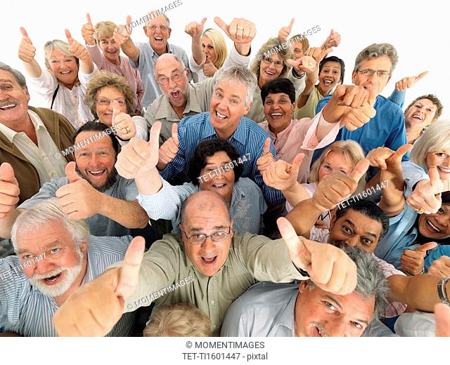 A group of people giving the thumbs up sign