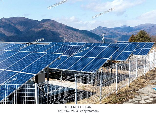 Solar panel with mountain range background