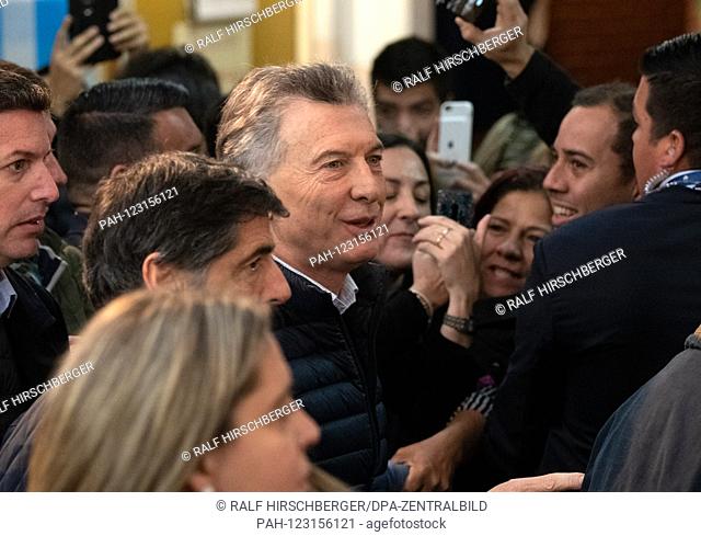 Mauricio Macri (M), President of Argentina, will vote in the primaries for the presidential election in a polling station in Buenos Aires