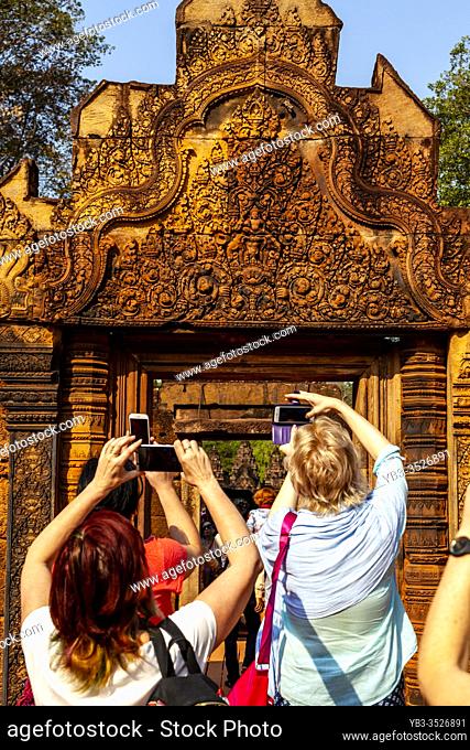 Visitors taking Photographs At Banteay Srey Temple, Angkor Wat Temple Complex, Siem Reap, Cambodia