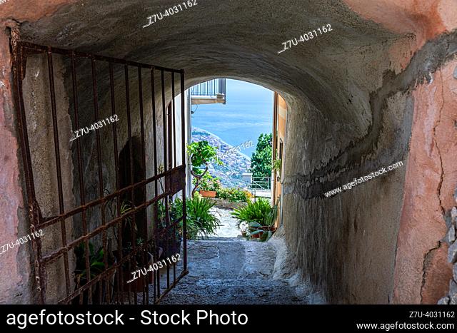 Sicilian alley overlooking the splendid blue sea