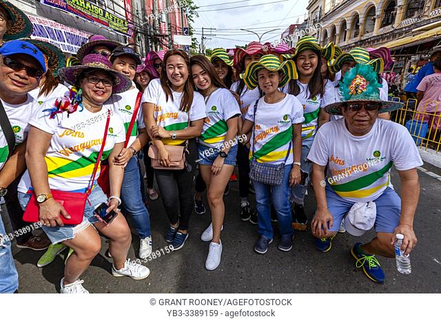 A Group Of Happy Filipino Revellers Pose For A Photo During The Dinagyang Festival, Iloilo, Panay Island, The Philippines