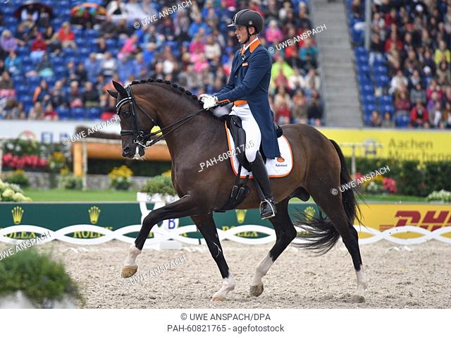 Diederik van Silfhout of Netherlands rides his horse Arlando in the Grand Prix Freestyle Dressage Individual Final during the FEI European Championships in...