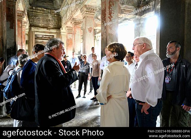 14 February 2023, Cambodia, Siemreab: German President Frank-Walter Steinmeier (2nd from right) and his wife Elke Büdenbender are informed by Hans Leisen about...
