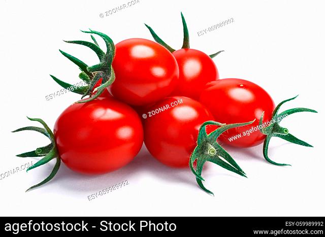 Cherry or grape cocktail tomatoes with sepals (Solanum lycopersicum). Clipping path, shadow separated