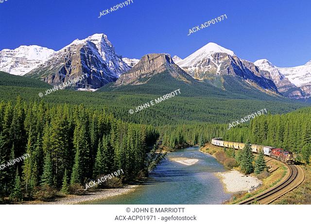 CPR locomotive and train on Morant's Curve along the Bow River In Banff National Park near Lake Louise, Alberta, Canada