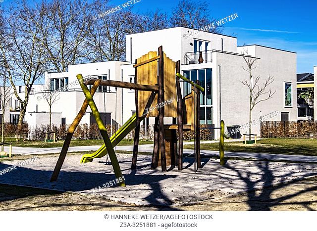Playground at residential Strijp-R with modern homes on the old factory site Philips, Eindhoven, The Netherlands