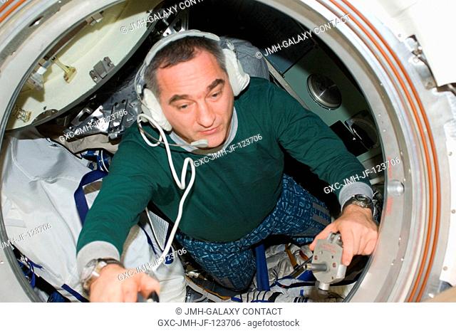 Russian cosmonaut Alexander Skvortsov, Expedition 24 commander, makes final preparations for his departure in the Soyuz TMA-18 docked to the Poisk Mini-Research...