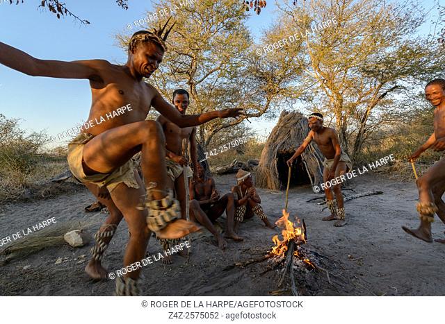 San or Bushman men dancing around a fire. Haina Kalahari Lodge. Botswana