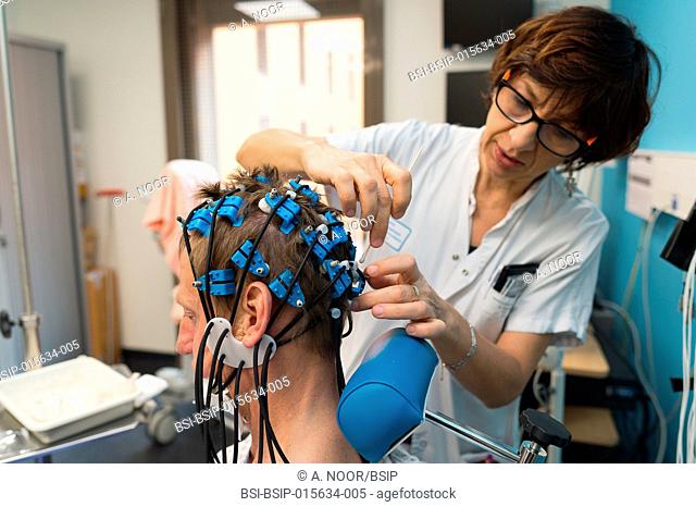 Reportage in the epileptology unit in Nice Hospital, France. Epilepsy diagnosis: EEG in a 52-year old patient hospitalized in the neurology service following a...
