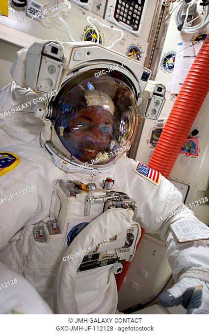 NASA astronaut Alvin Drew, STS-133 mission specialist, attired in an Extravehicular Mobility Unit (EMU) spacesuit, is pictured in the Quest airlock of the...