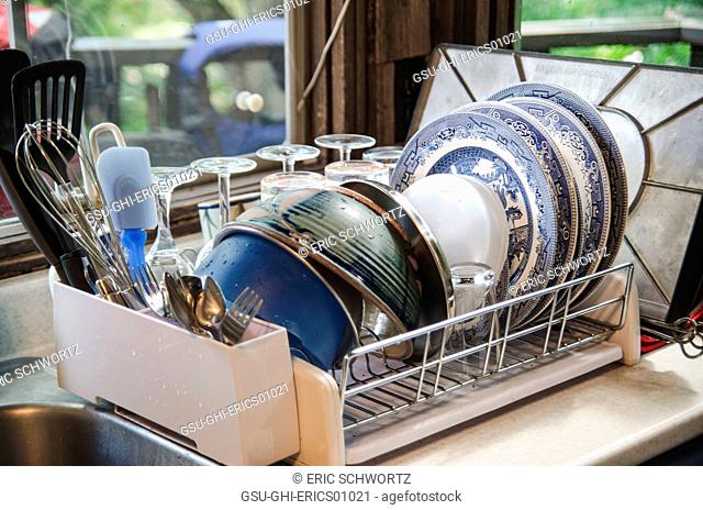 Clean Dishes in Drying Rack on Kitchen Counter