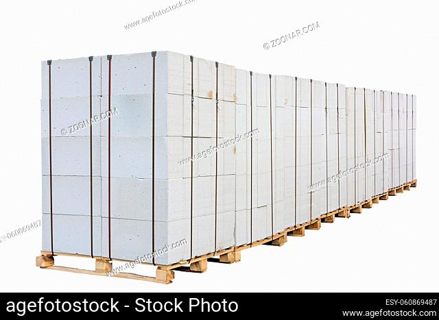 Concrete (aerated concrete) blocks on the pallet. Isolated on white background. Clipping path is saved