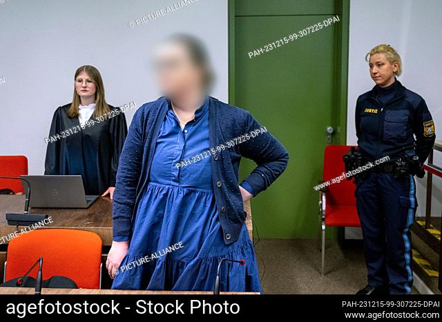 15 December 2023, Bavaria, Munich: The defendant Andrea Tandler (center) stands in the courtroom of the district court before the verdict is announced