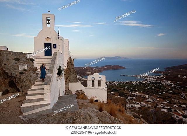 Woman climbing up the stairs of the Agios Constantinos church in Hora, Serifos, Cyclades Islands, Greek Islands, Greece, Europe