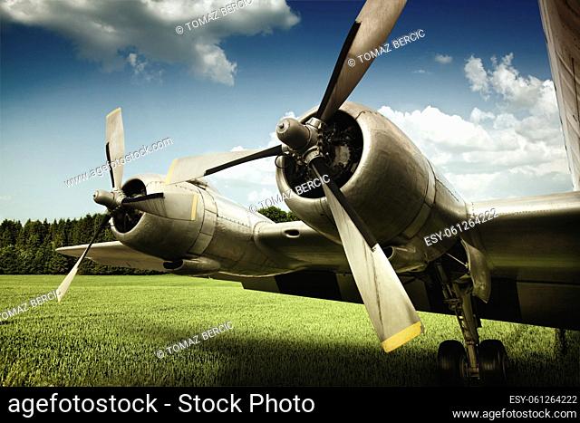 old DC6 airplane on grass