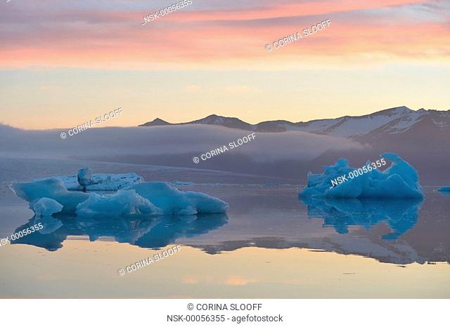 Iceberg formations in the Jokulsarlon glacier lake during sunrise, Iceland, Jokulsarlon