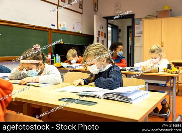 Illustration picture shows school schildren wearing mouth masks in their classroom at a primary school in Gent, Monday 06 December 2021