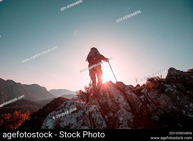 Man in a hike in the summer mountains. Beautiful natural landscapes